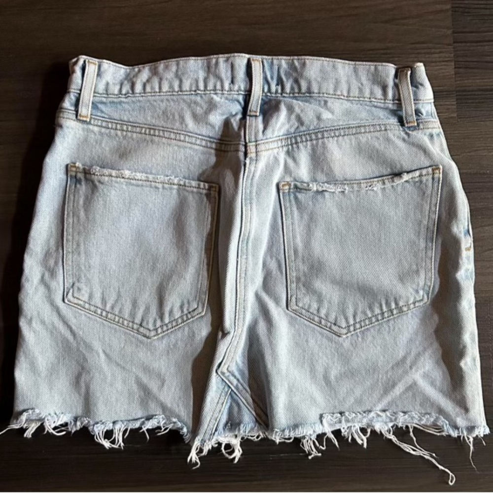 light wash ripped mini skirt.